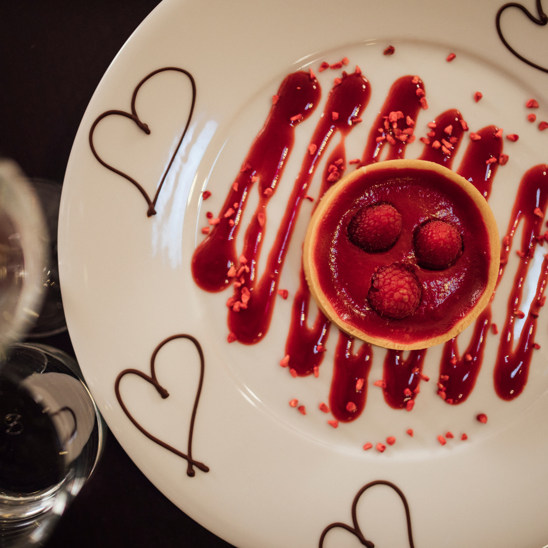 Valentines lunch dessert setting with a raspberry posset