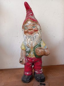 A Vintage Garden Gnome probably dating from the 1940's. Approx 28cm height.
This gnome has two clasped hands, so would have originaaly been carrying wooden garden tools.
Price £90