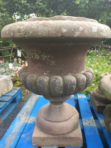 A pair of carved sandstone urns dating from late 18th century or early 19th century, in campana form and with lovely and genuine aged appearance. The square base is around 30cm x 30cm and the overall height of the urn approx 70cm. The diameter is approx 58cm. A gorgeous pair of antique urns rarely available to purchase. REF ThR21725-343 £1850 the pair